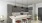 Modern kitchen in a one-bedroom apartment at Camber Ranch, featuring sleek countertops, a stove, refrigerator, and ample cabinetry