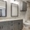 Modern bathroom at Camber Ranch with a sleek vanity, large mirror, and stylish fixtures