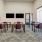Business meeting room at Camber Ranch with a large conference table, comfortable chairs, and a presentation screen
