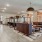 Modern business center at Camber Ranch with sleek desks, ergonomic chairs, and large windows providing natural light