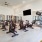Fitness center at Camber Ranch with modern exercise equipment, including treadmills, stationary bikes, and free weights, set in a spacious, well-lit room