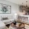 Spacious living room at Camber Ranch with stylish furniture, including a sectional sofa, coffee table, and surrounded by modern decor 