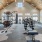 Modern fitness center at Camber Ranch with a variety of exercise equipment, including treadmills, stationary bikes, and free weights, set in a bright, well-lit space