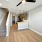 Loft-style room at Camber Ranch featuring an open layout with a staircase leading to an upper level, and modern furnishings