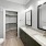 Primary bathroom at Camber Ranch featuring a modern design with a large vanity, spacious shower, and elegant fixtures