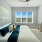 Cozy bedroom at Camber Ranch with modern furnishings, a comfortable bed, and a stylish, inviting decor