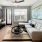 Model living room with stylish furnishings, large windows, and access to a private patio or balcony at Camber Ranch